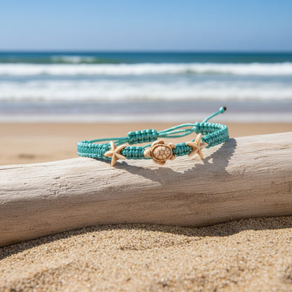 Adjustable Turquoise Sea Turtle Anklet on driftwood at the beach
