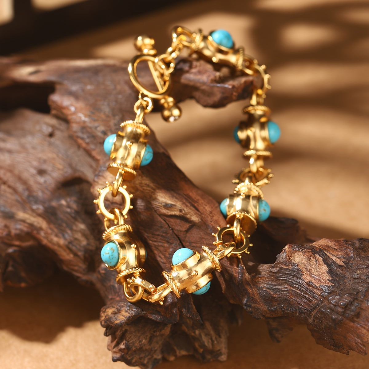 Elegant Turquoise Cabochon Link Bracelet on driftwood