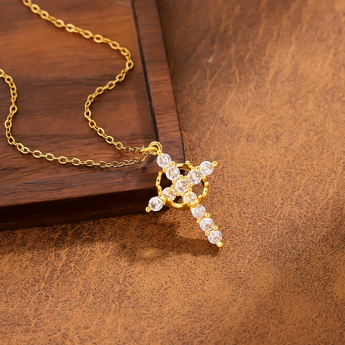 Radiant Crystal Cross Necklace flat lay on satin