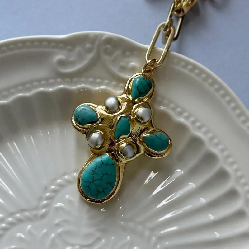 Close-up of the turquoise cross pendant