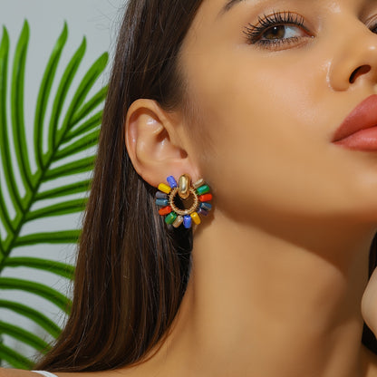 Beaded fan earrings worn on the ear