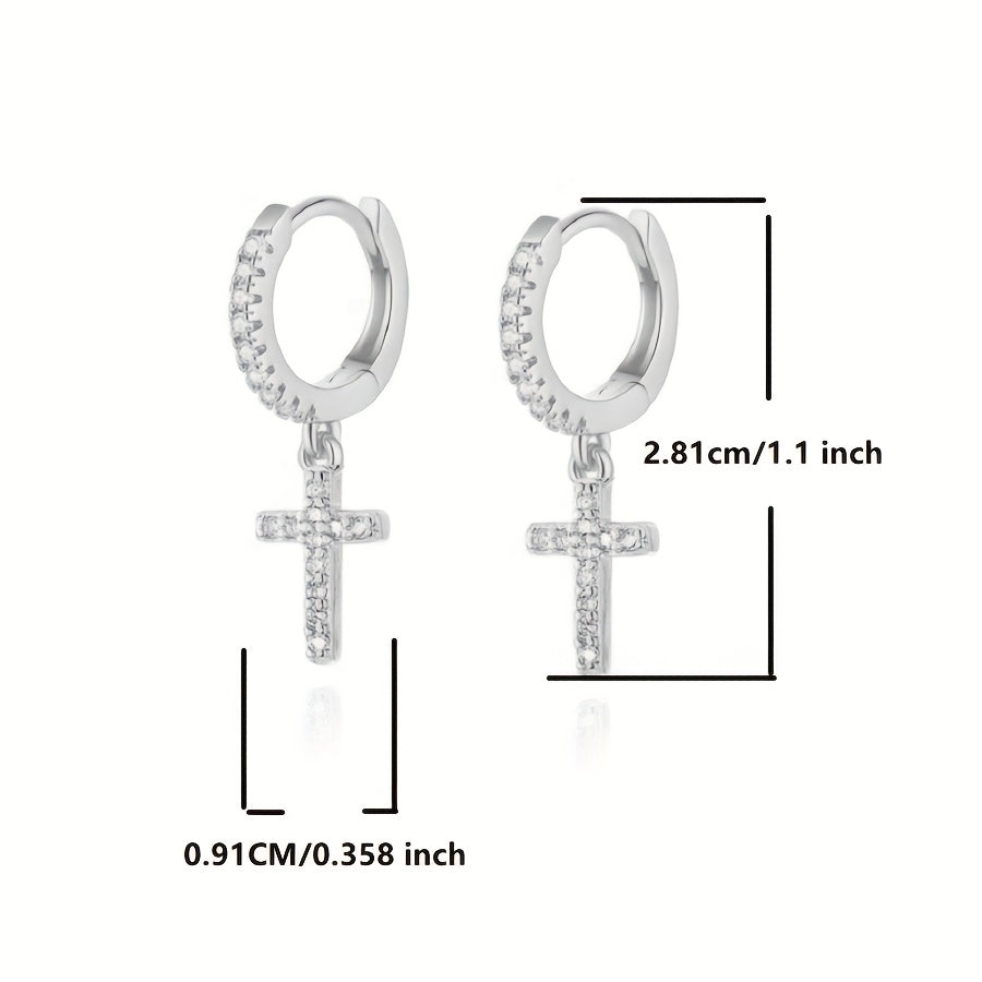 Close-up of the Polished Cross Huggie Earrings in silver