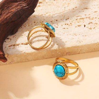 Detail of the turquoise stone and Greek key setting