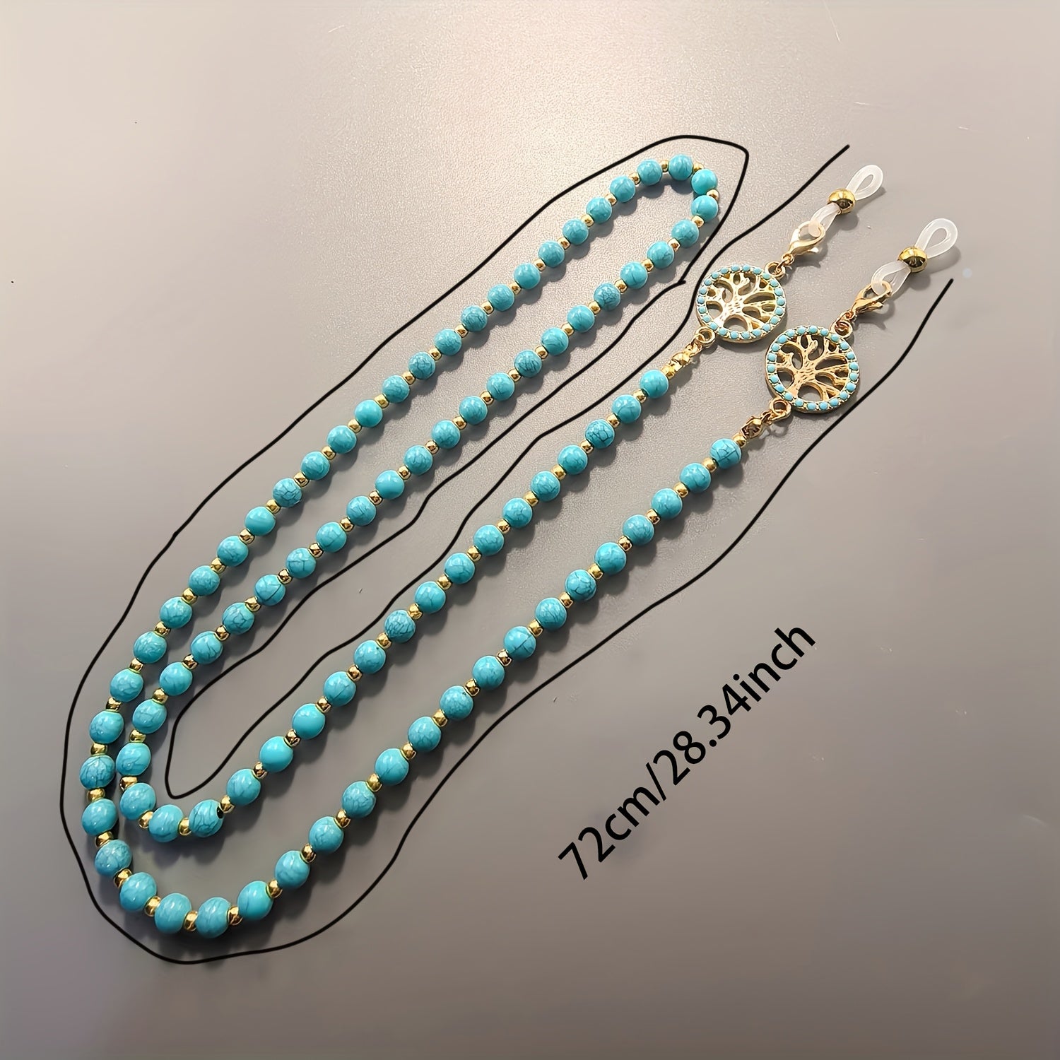 Close-up of the turquoise beads and tree of life charm