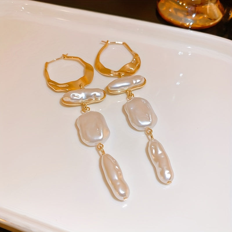 Elegant Baroque Pearl Hoop Earrings shown on a light surface