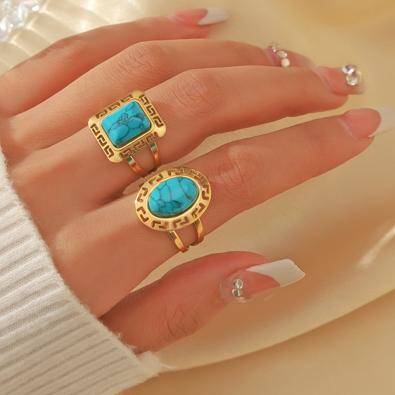 Both shapes of the Vintage Turquoise Greek Key Ring worn on the hand