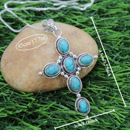 Bohemian Turquoise Cross Necklace detail on a stone