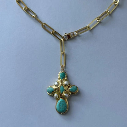 Detail of the turquoise cross and paperclip chain