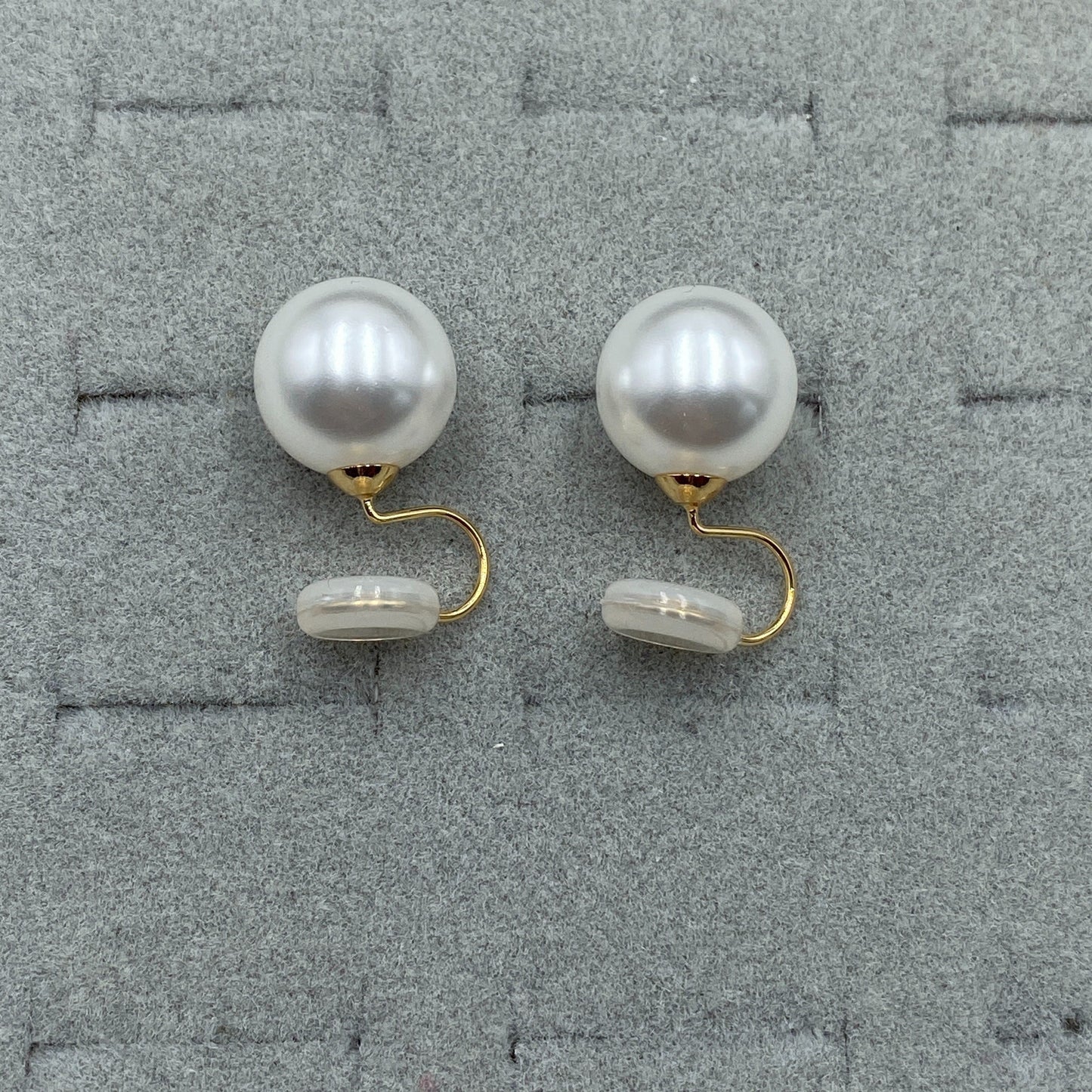 Vintage Round Pearl Clip Earrings on a light surface