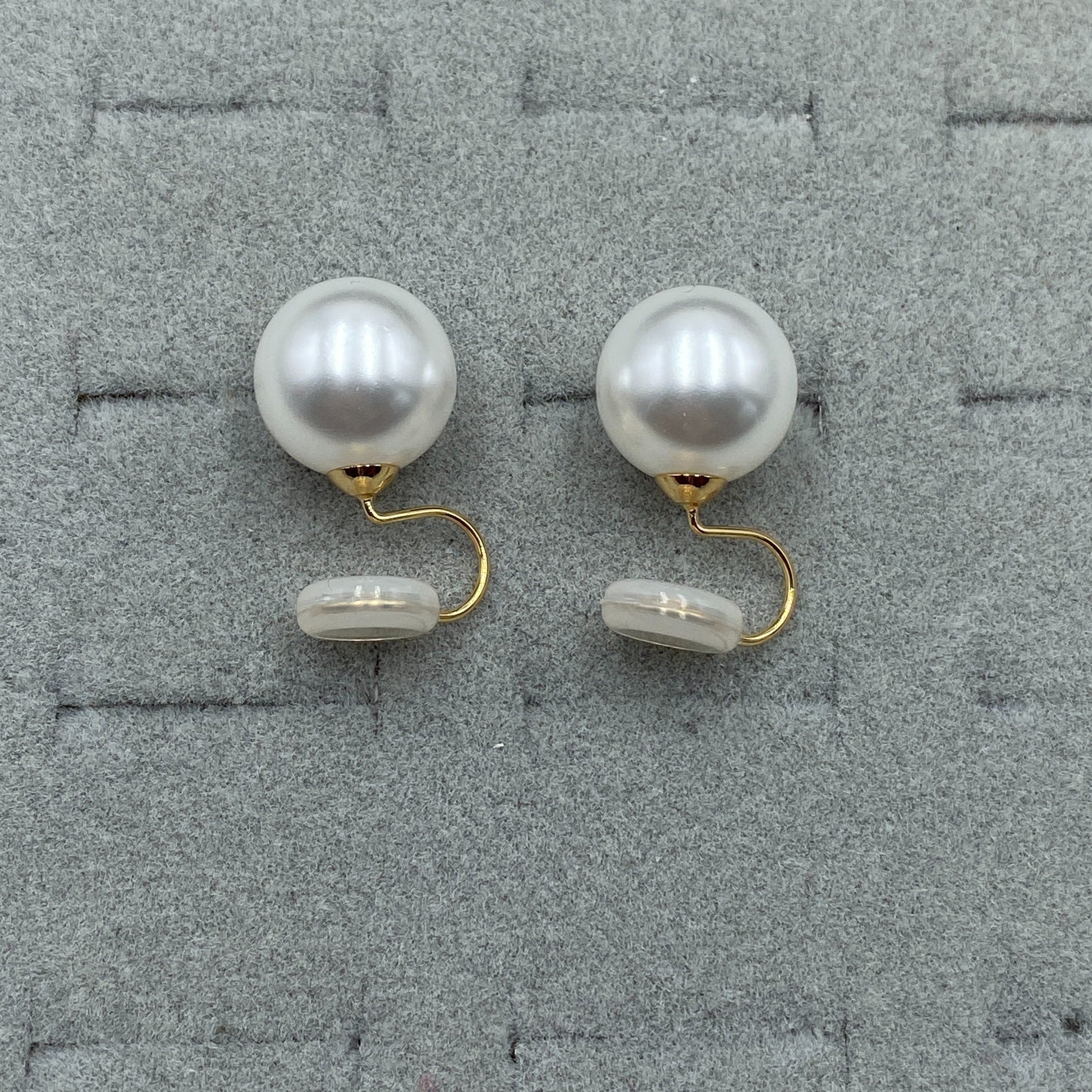 Vintage Round Pearl Clip Earrings on a light surface