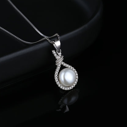 Close-up of the pearl in its twisted zirconia setting