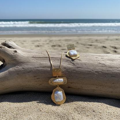 Matching pearl mosaic earrings worn on the ear