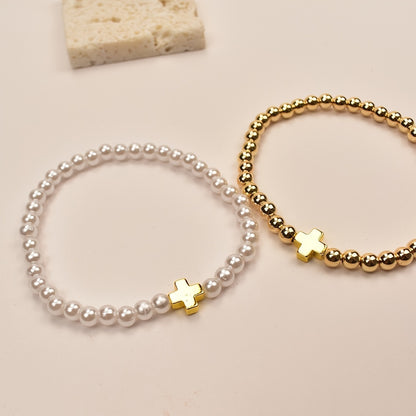 Delicate Pearl Cross Bracelet Set flat lay