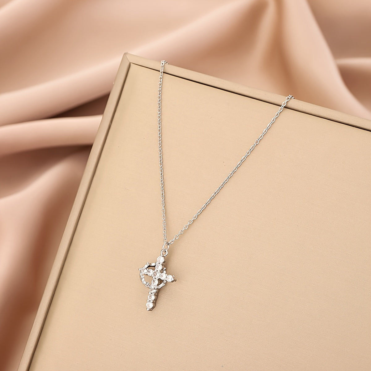 Radiant Crystal Cross Necklace lifestyle shot outdoors