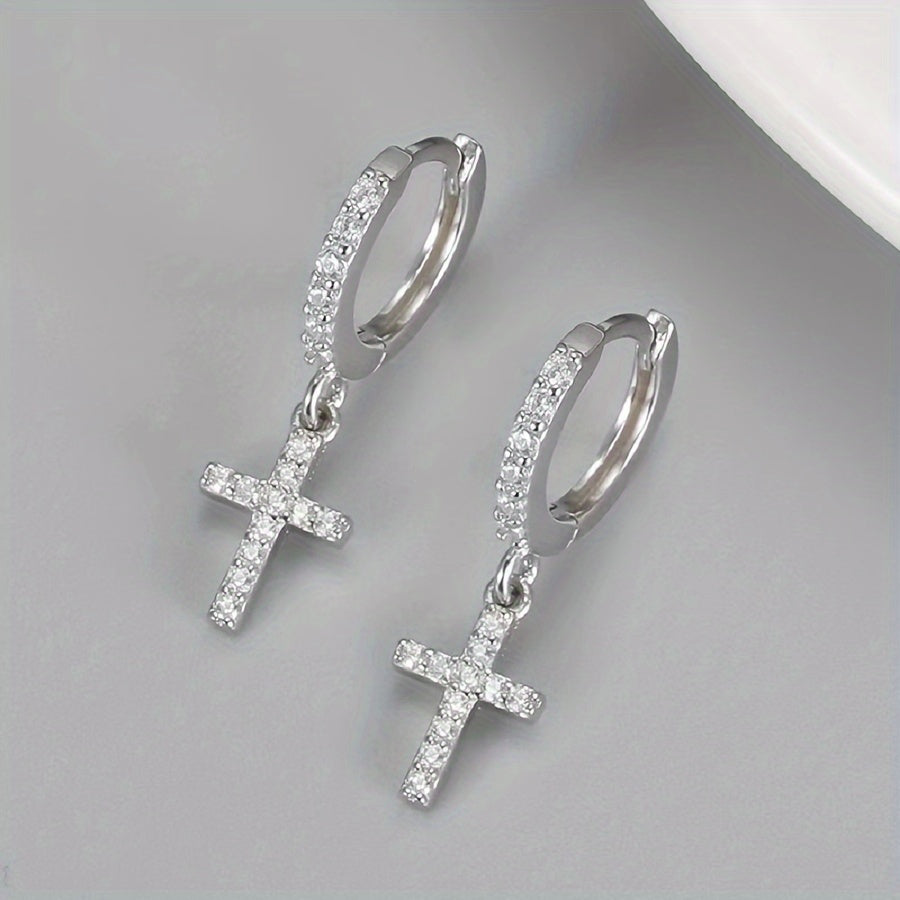 Polished Cross Huggie Earrings styled flat lay