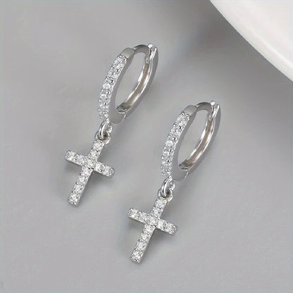 Polished Cross Huggie Earrings styled flat lay