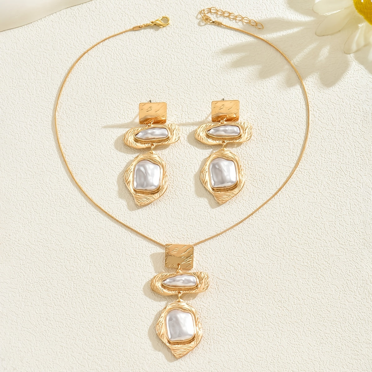 Necklace and earrings from the set worn together