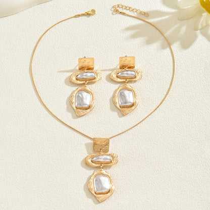 Necklace and earrings from the set worn together