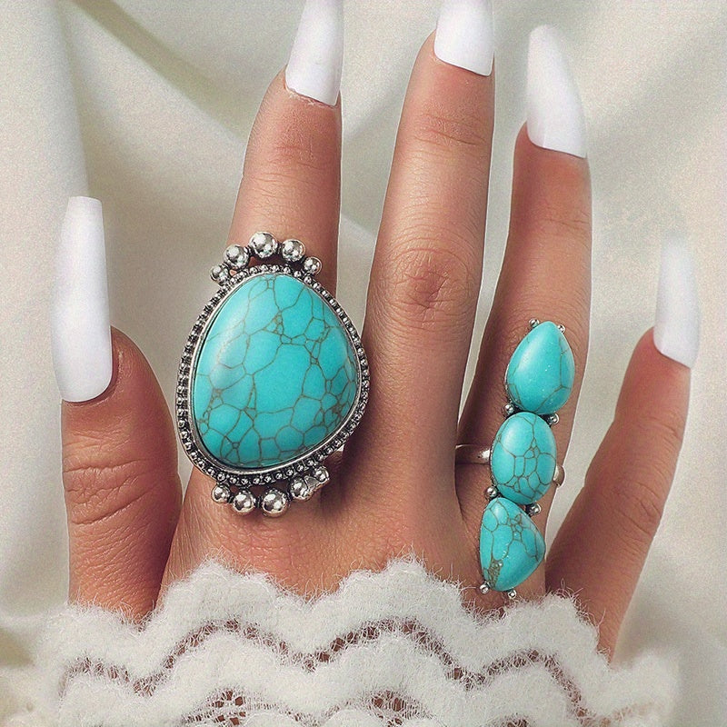Both turquoise rings worn together on the hand