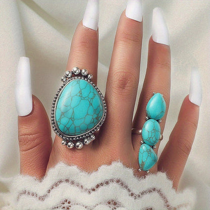 Both turquoise rings worn together on the hand
