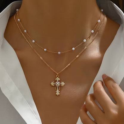 Graceful Layered Pearl Cross Necklace lifestyle shot outdoors