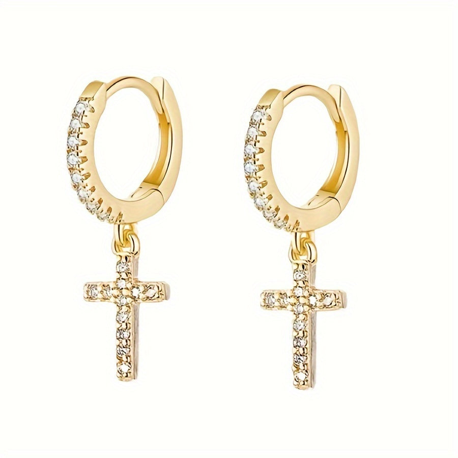 Close-up of the Polished Cross Huggie Earrings in gold