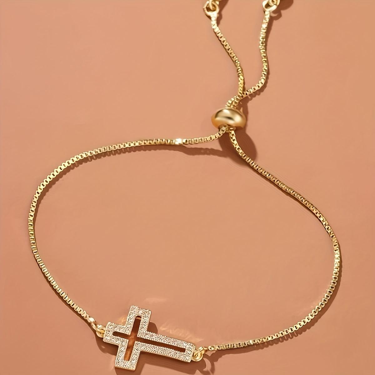 Close-up of the Classic Adjustable Cross Bracelet pendant