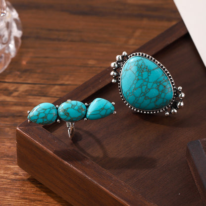 Side view of the two turquoise rings