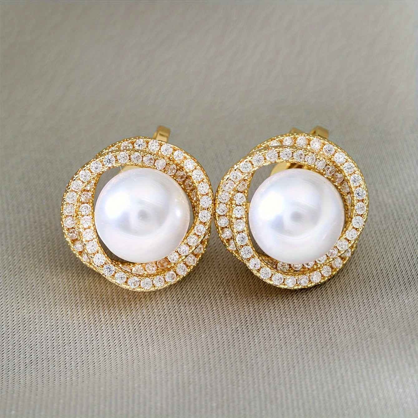 Classic Pearl Halo Clip Earrings worn on the ear