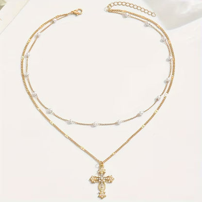 Close-up of the pearl and crystal cross pendant
