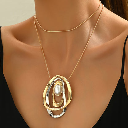 Statement Pearl Geometric Pendant Necklace worn with a black top