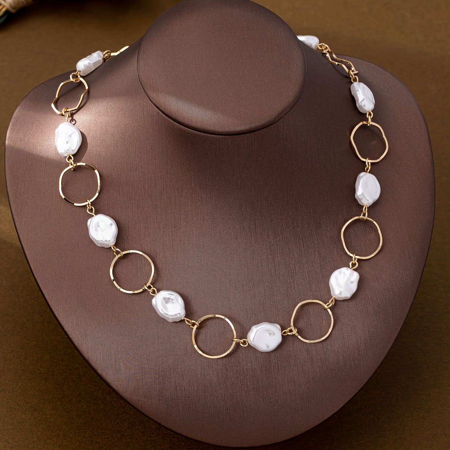 Vintage Baroque Pearl Link Necklace displayed on a stand